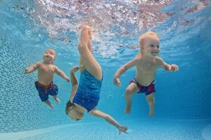 three children playing in the water in the pool at Brilliant 8 Berth Caravan With Decking At Haven Caister Beach Ref 30055p in Great Yarmouth