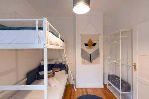 a room with two bunk beds and a hallway at Bohemian Bakoua & Chesterfield Cottage, hyper-centre in Metz