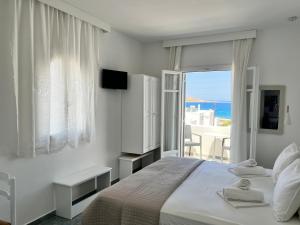 A bed or beds in a room at Vavanos Studios