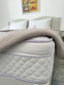 A bed or beds in a room at Vavanos Studios
