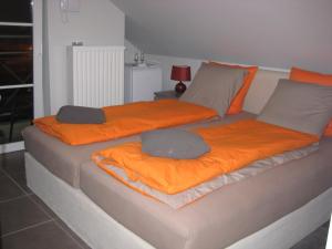 a bed with two pillows on top of it at Nobel in Westende