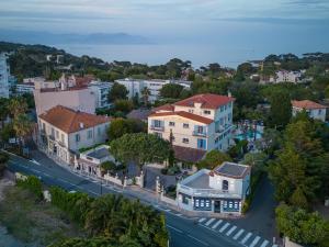 an aerial view of a town with houses and a street at Hôtel Beau Site - Cap d'Antibes in Antibes