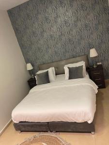 Postel nebo postele na pokoji v ubytování H7 TLV