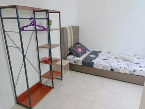 a bedroom with a bed and a book shelf at Yarra Park, Up to 10 Pax, 5 Bedrooms, 4 Bathrooms, 2 Car Parks by Star Home in Sungai Petani +16 photos