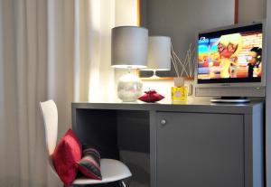 TV a/nebo společenská místnost v ubytování Hotel Metropol
