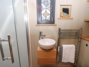 a small bathroom with a sink and a window at Malbec in Seaview