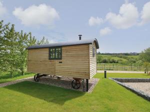 a tiny house on a stand in a field at Malbec in Seaview