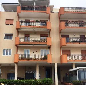 an apartment building with balconies and plants on it at La Stella di Gallipoli in Gallipoli