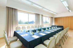 a large conference room with a long table and chairs at TRYP by Wyndham Porto Expo Hotel in Leça da Palmeira