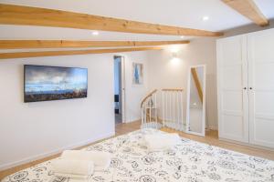 a living room with a bed and two pillows at Holiday home Country retreat in Višnjan