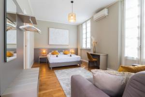 Postel nebo postele na pokoji v ubytování Martini Suite