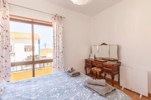 Postel nebo postele na pokoji v ubytování Ninestories Baleal