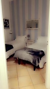 Ein Bett oder Betten in einem Zimmer der Unterkunft All Suite Colosseo