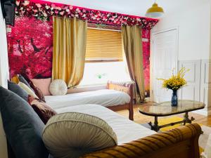 a living room with a couch and a table at Big Group Stays in Brighton & Hove