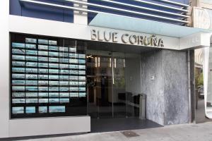 
a building that has a sign on the side of it at Eurostars Blue Coruña in A Coruña

