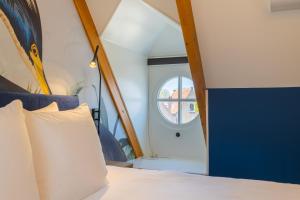 Postel nebo postele na pokoji v ubytování Hotel St Joris I Kloeg Collection