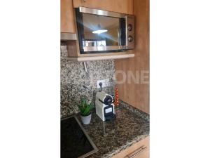 Kuchnia lub aneks kuchenny w obiekcie Apartamento Vacacional A Lanzada