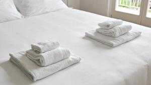 A bed or beds in a room at Hotel Corte Santa Libera