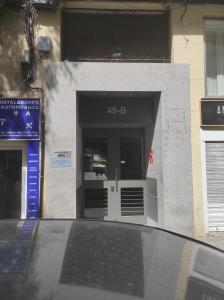 a front door of a building with a door at Apartamento con jardin privado y portero (B) in Madrid