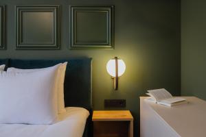 Postel nebo postele na pokoji v ubytování Hotel St Joris I Kloeg Collection