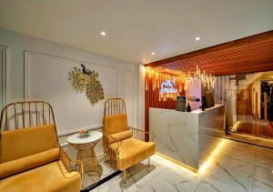 a living room with a couch and chairs and a table at S419 Love Nest in Ho Chi Minh City +3 photos