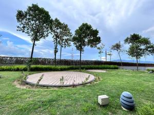 a grassy field with trees and a fence at Semenyih kajang kiara plaza kids Land in Kajang