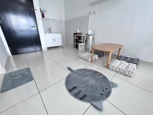 a white tiled floor with a table and a stool at Semenyih kajang kiara plaza kids Land in Kajang