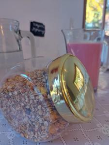 a glass bowl filled with coins on a table at Pousada do Pórtico in Gramado