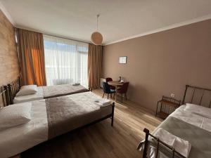 A bed or beds in a room at Old district