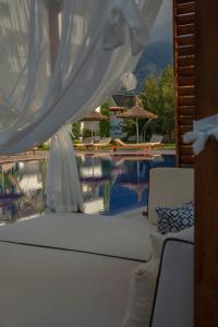 a view of a swimming pool from the back of a boat at Palmonte Suites Hotel & SPA in Kyrenia