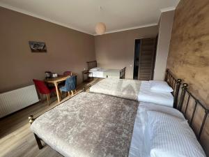 A bed or beds in a room at Old district