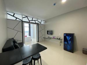 a living room with a black table and chairs at FORMOSA RESIDENCE NAGOYA -The Apartments 1 Bed Room 173A in Nagoya