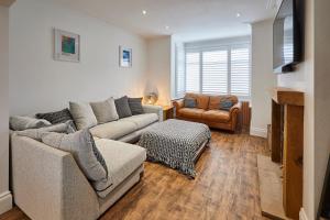 a living room with two couches and a television at Host & Stay - Holme Rigg in Whitby