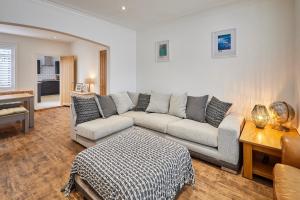 a living room with a couch and a table at Host & Stay - Holme Rigg in Whitby