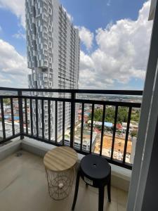 a balcony with a table and a view of the ocean at FORMOSA RESIDENCE NAGOYA -The Apartments 1 Bed Room 173A in Nagoya