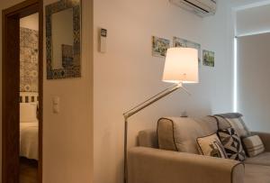 a living room with a lamp and a couch at Best of Principe Real Liberdade in the Heart of Lisbon with Private Parking in Lisbon