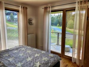 Postel nebo postele na pokoji v ubytování Apartmán NatEmi u sjezdovky Filipovice