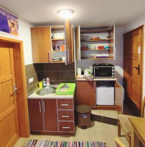 Kuchyň nebo kuchyňský kout v ubytování Summit Apartment