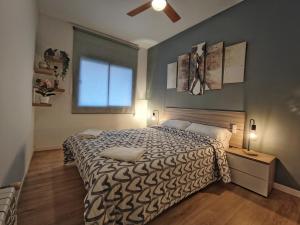 Posteľ alebo postele v izbe v ubytovaní LG DownTown Sabadell Apartment
