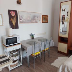 a small kitchen and dining room with a table and chairs at Jasmina in Senj