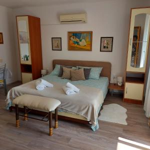 a bedroom with a bed with towels on it at Jasmina in Senj