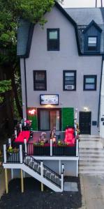 a house with red furniture in front of it at Private Luxe Room A Hidden Gem With Private Bath & Kitchen in Philadelphia