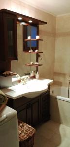 a bathroom with a sink and a bath tub at Cozy Apollon Villa, Sea View, Next To Galaxidi in Eratini