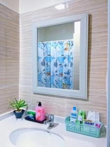 a bathroom with a sink and a mirror at Arthomes BB6 in Mandaue City +9 photos