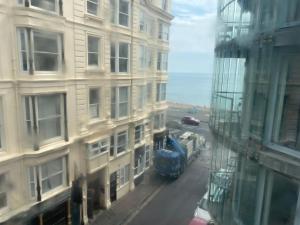 a view from a window of a city street with a bus at Seaside Hotel in Brighton & Hove