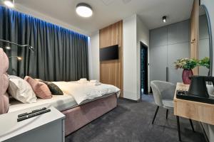 a hotel room with a bed and a desk at Rooms Florek & Florica in Križevci