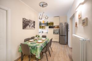 a kitchen and dining room with a table and chairs at Maspes house in Santa Margherita Ligure