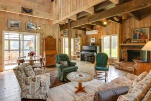 a living room with a couch and chairs and a fireplace at Serene Salisbury Rental Home on 26 Acres with Deck! in Salisbury