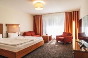 Ένα ή περισσότερα κρεβάτια σε δωμάτιο στο Consulat des Weins