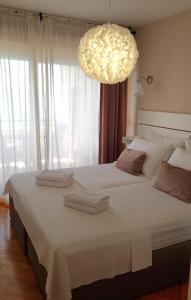 Posteľ alebo postele v izbe v ubytovaní Ocean apartman